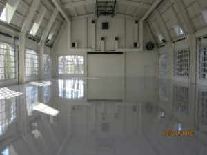 Alan Jackson Garage - white large garage with at least 7 windowed garage doors