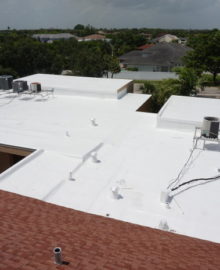 COMMERCIAL ROOF COATING - white flat roof and red shingle roof